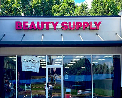 Professional LED channel letter installation for a beauty supply store, creating a bold storefront presence that is easy to see both day and night.