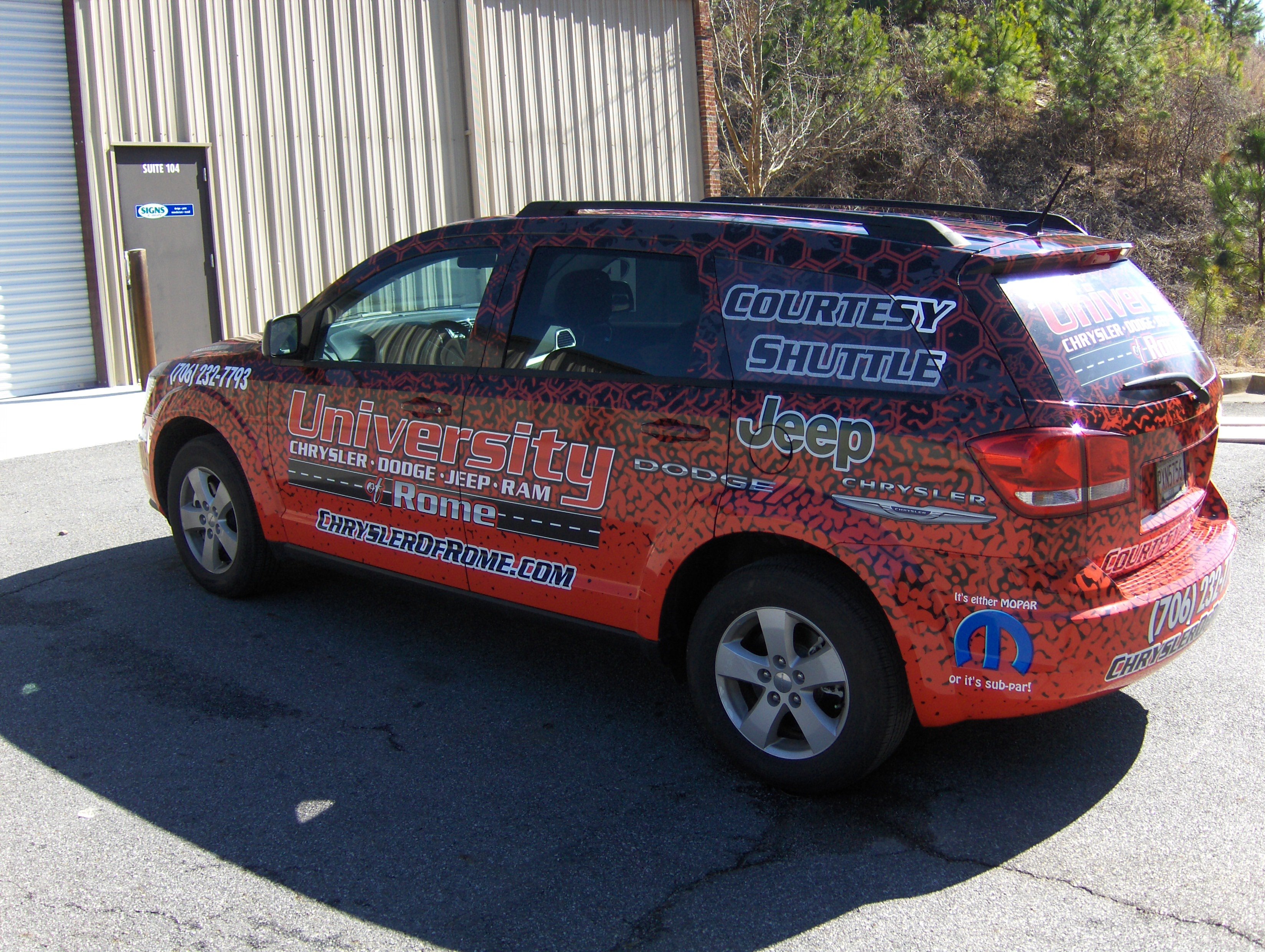 Courtesy-Car-Wrap perforated sign custom install