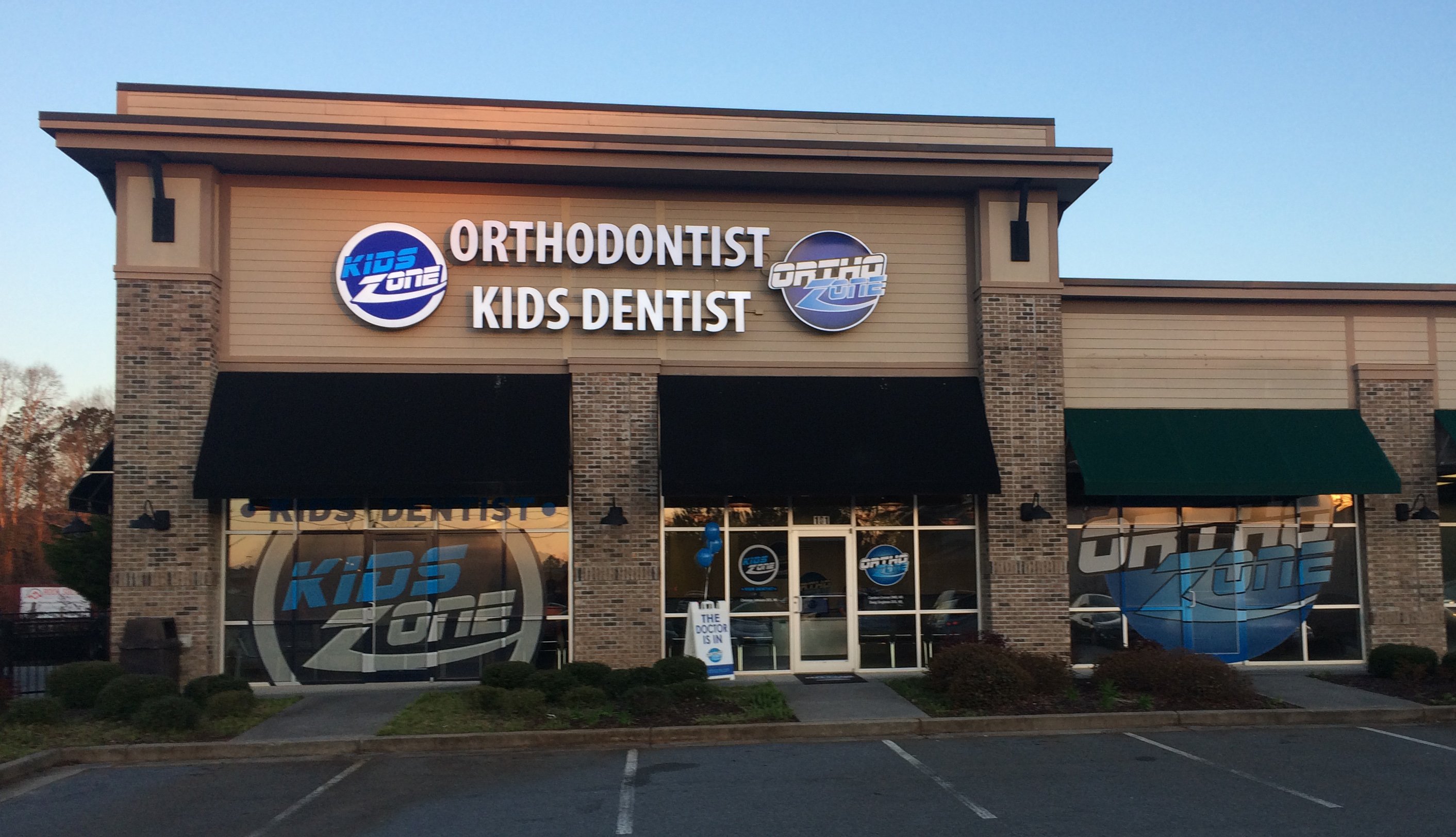 Lighted Channel Letter Sign, Window Perforated vinyl graphics, lighted letters and logo boxes