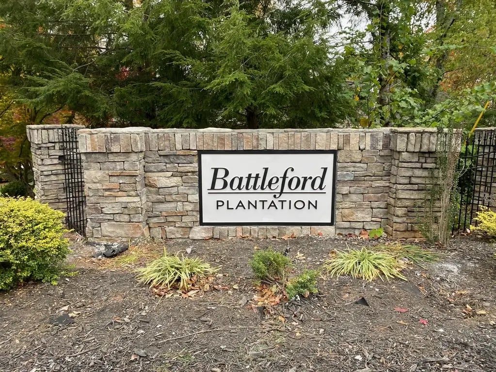 Stone Monument Sign with Fence and Routed HDU Sign Panel