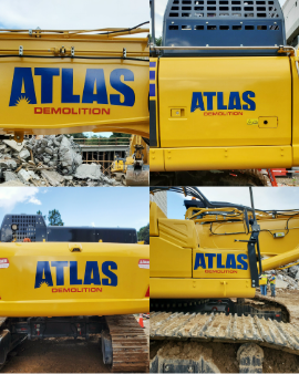 Yellow Atlas Demolition excavator with custom logo decals and equipment graphics