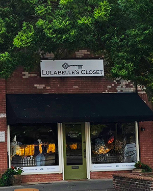 Lulabelle’s Closet storefront sign above black awning, designed and installed by Signs &amp; More, Inc., Cartersville, GA.