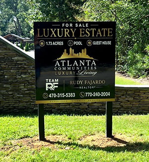 For sale post and panel sign outside of an Atlanta neighborhood by Signs and More