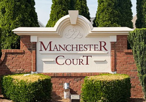 power-washed, repaired, and repainted neighborhood monument sign in Cumming, Georgia