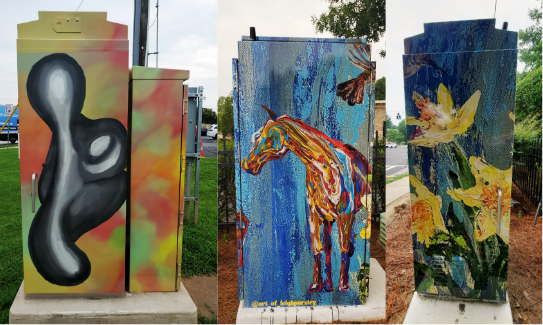 Custom vinyl wraps installed on traffic signal control boxes throughout Smyrna, Georgia, featuring colorful artwork by local artists including an abstract design, a painted horse, and yellow flowers. Printed and installed by Signs and More to enhance public spaces with durable outdoor graphics.
